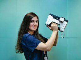 Photo of Leyla holding a 3D scanner