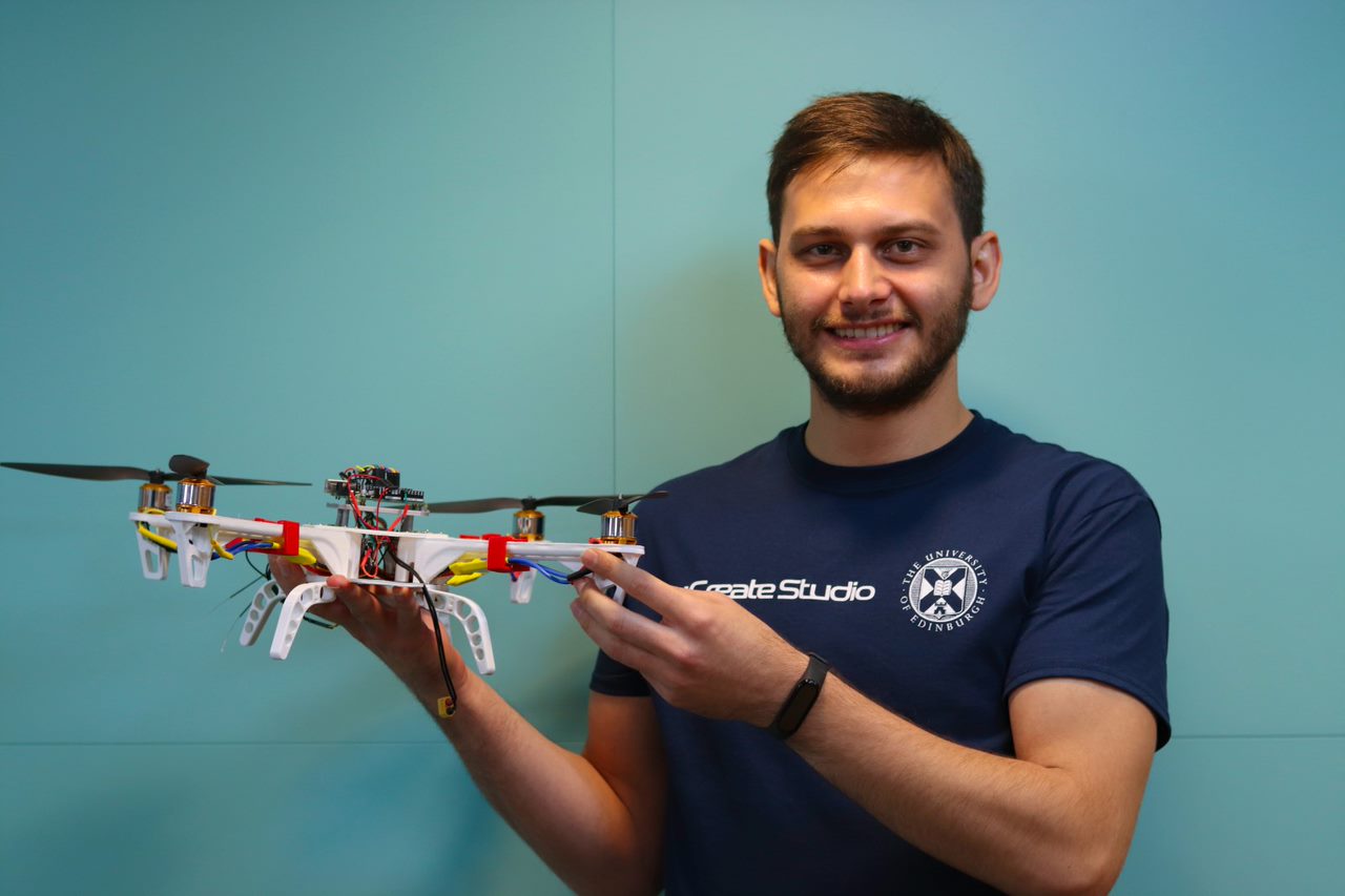 Photo of Murat holding a drone